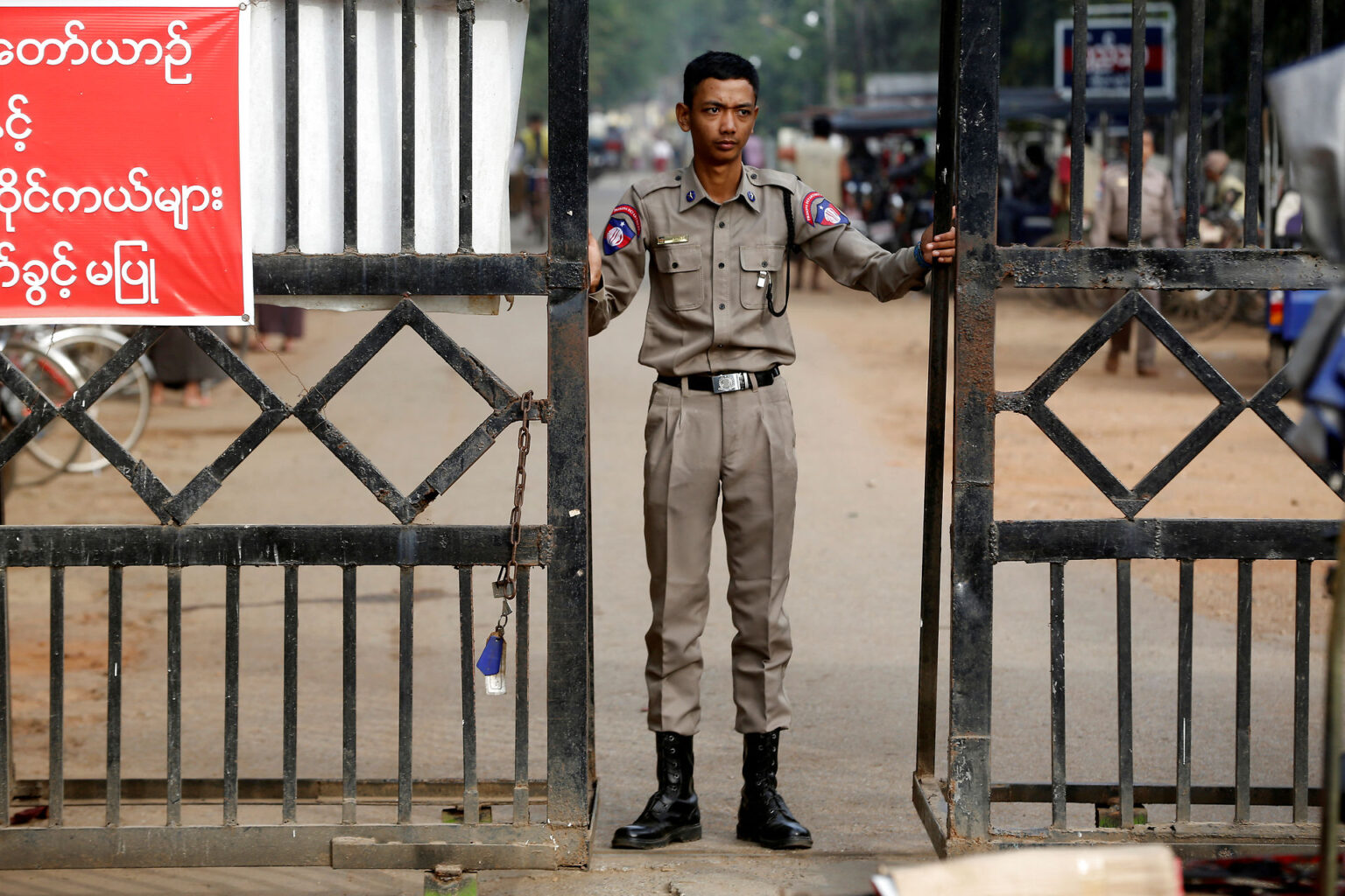 FILE PHOTO: A member of staff stands guard at Insein prison in Yangon