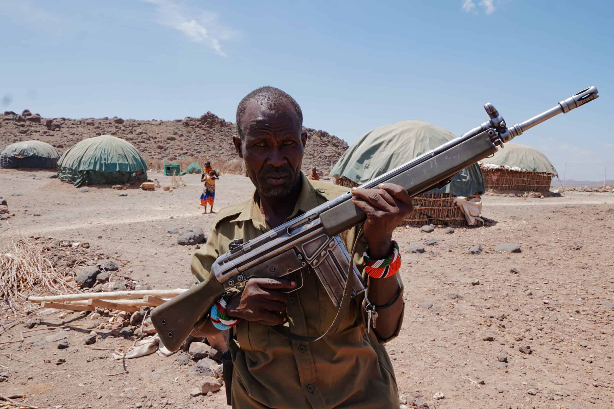 Losike. Security guard in Sarima watching over cattle and people.