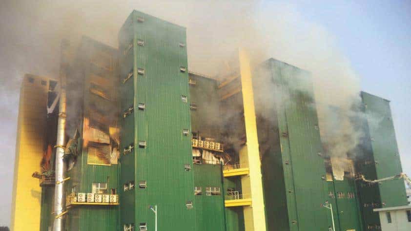 Smoke rises from a garment factory