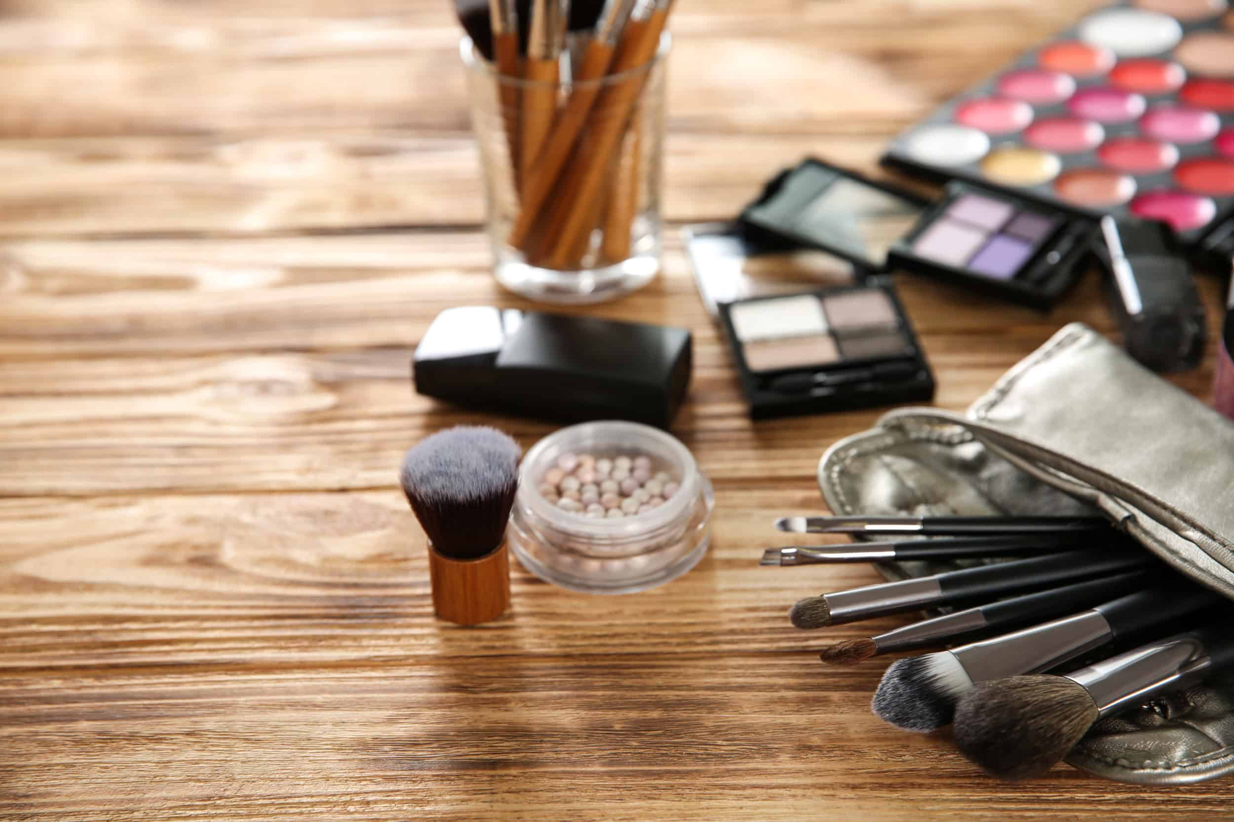 Professional make up accessories on wooden table
