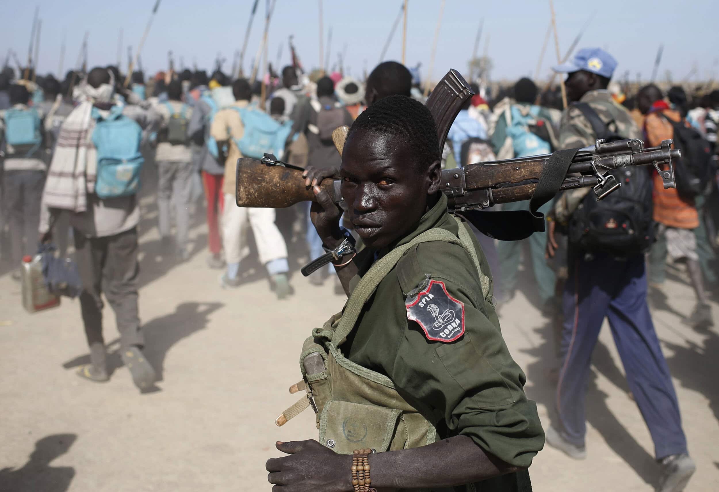 Jikany Nuer White Army fighters hold their rifles as they walk in a rebel controlled territory in Upper Nile State